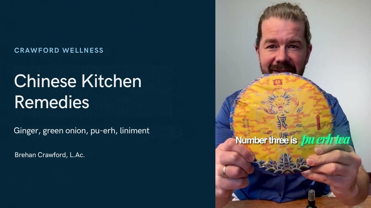 Chinese home remedies to keep in your kitchen: Brehan Crawford, L.Ac., holding a cake of pu-erh tea