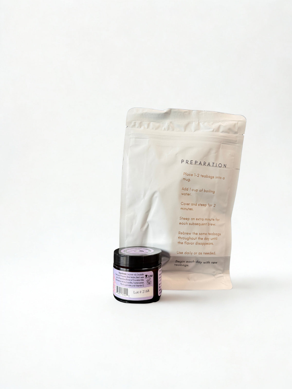 White packaging with text and a small jar on a white background