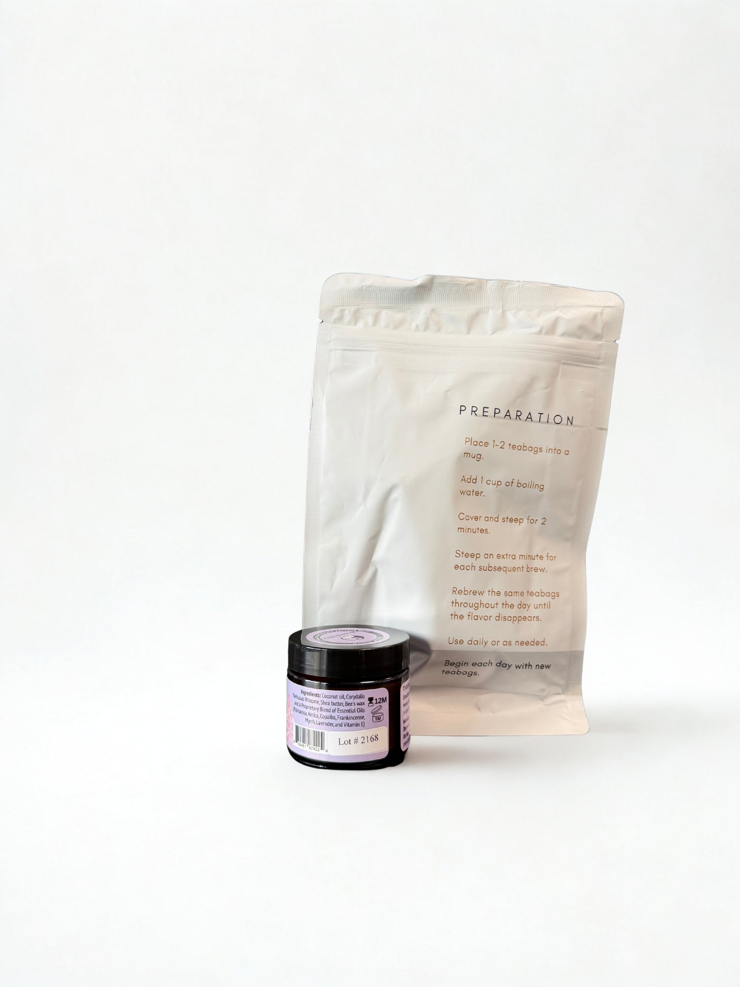White packaging with text and a small jar on a white background