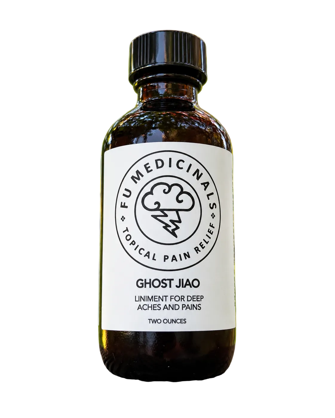 A small amber glass bottle of Ghost Jiao herbal liniment by Fu Medicinals on a white background.