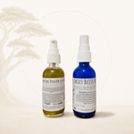 Two bottles of 'Healing Dragon Serum' and 'Skies Bliss Mist' on a light background
