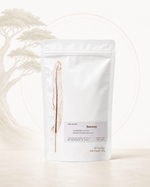 Sacrocox herbal tea (Cyathulae Radix formula) from Crawford Wellness, with a white label, in a white stand-up pouch on a sage green background.