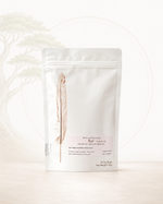 White tea packaging with a feather design on a white background