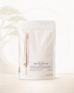 Tea package with a feather illustration and text on a white background